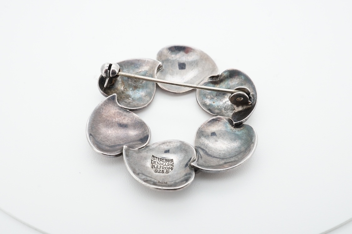 A 1960's Danish silver foliate brooch, by Nils Erik From, import marks possibly for Henry James Hulbert, London, 1964, 37mm, together with a moss agate set white metal bar brooch and a two colour enamel and paste set met